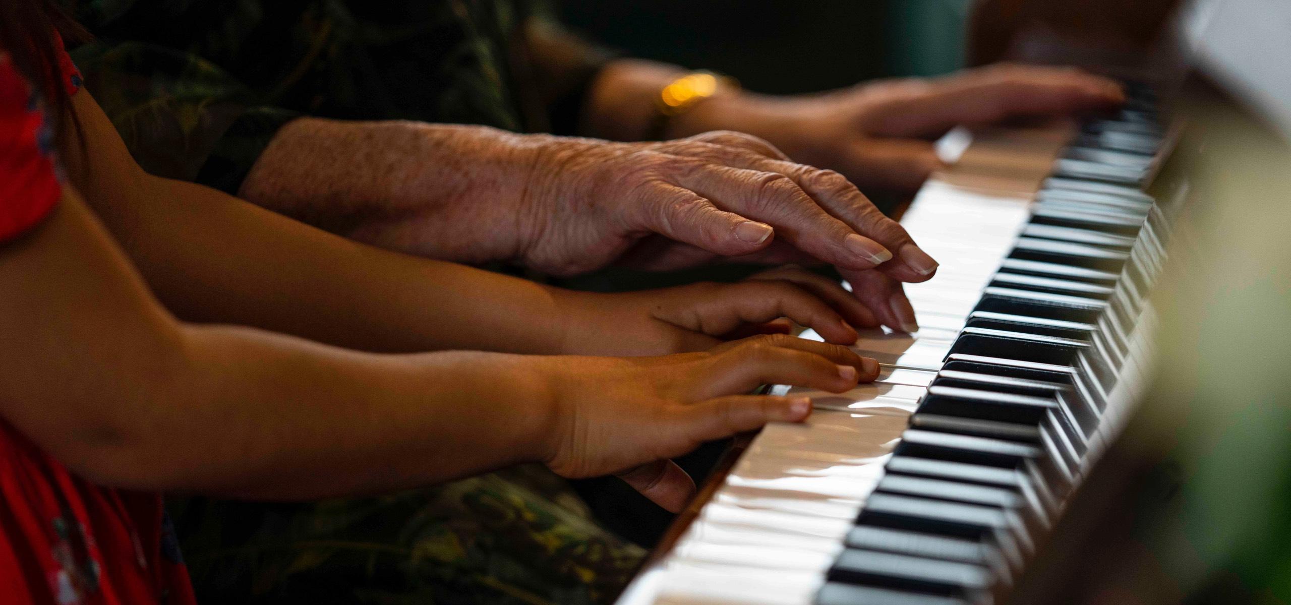 Oceania residents playing piano together